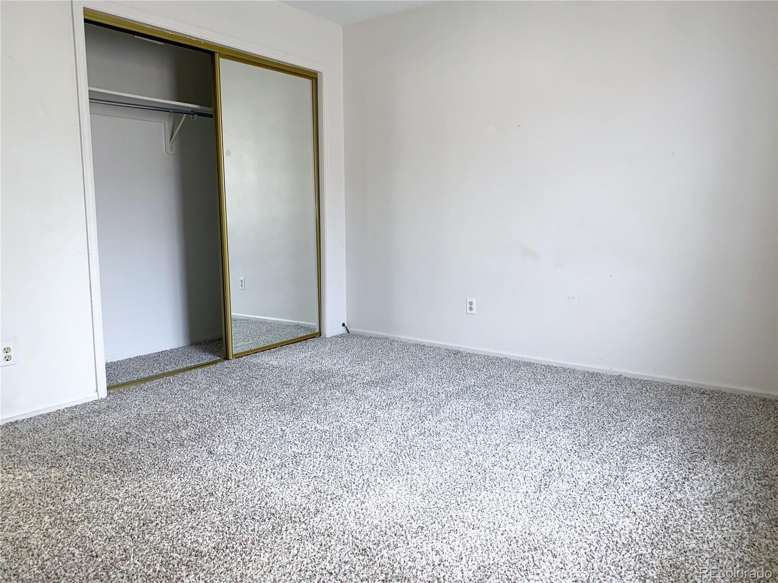 8423 Everett Way, Unit B Arvada, CO 80005 - Photo 27 of 27 an empty room with closet area