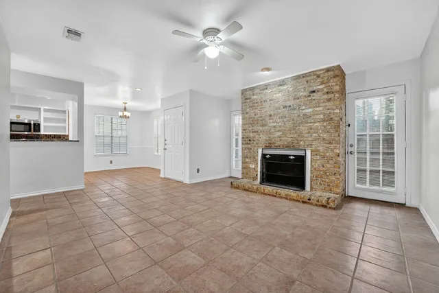 a kitchen with stainless steel appliances granite countertop a refrigerator and a stove