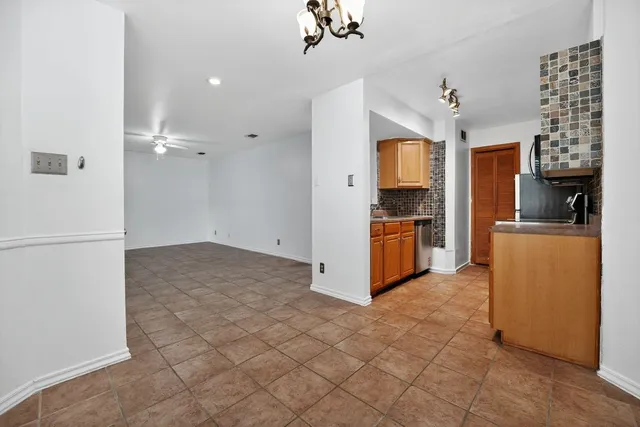 a kitchen that has a sink and a stove