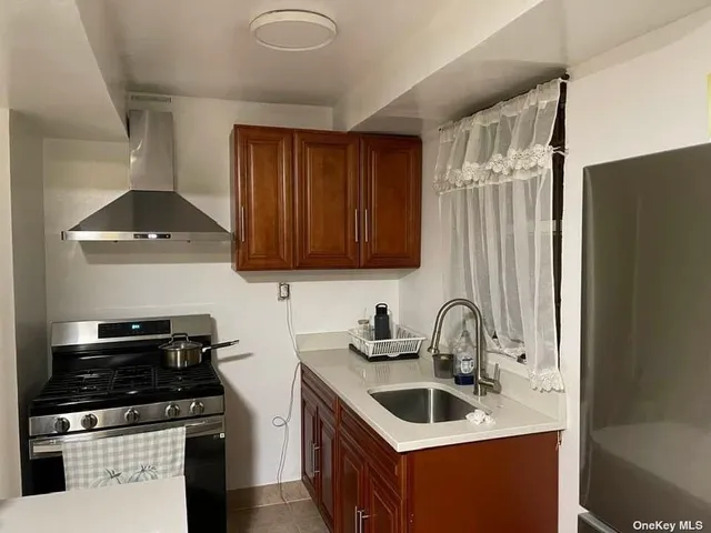 a kitchen that has a sink and a stove