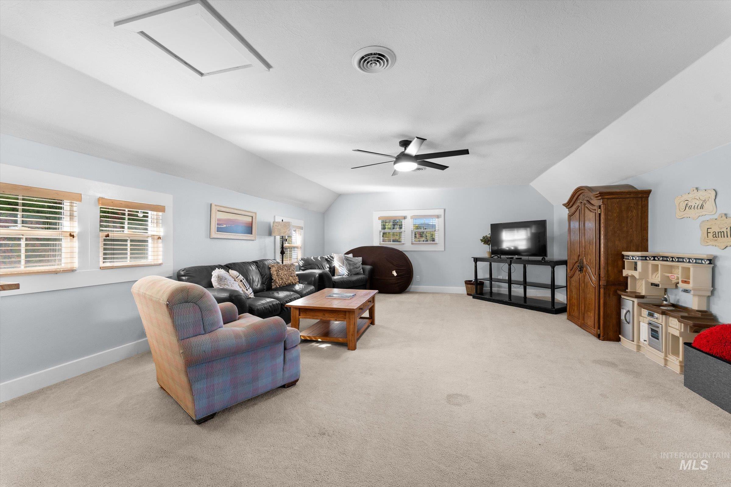 315 South Middlefork Road Garden Valley, ID 83622 - Photo 39 of 49 Living room featuring light carpet and lofted ceiling