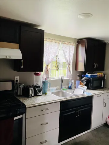 a white toilet sitting next to a shower curtain