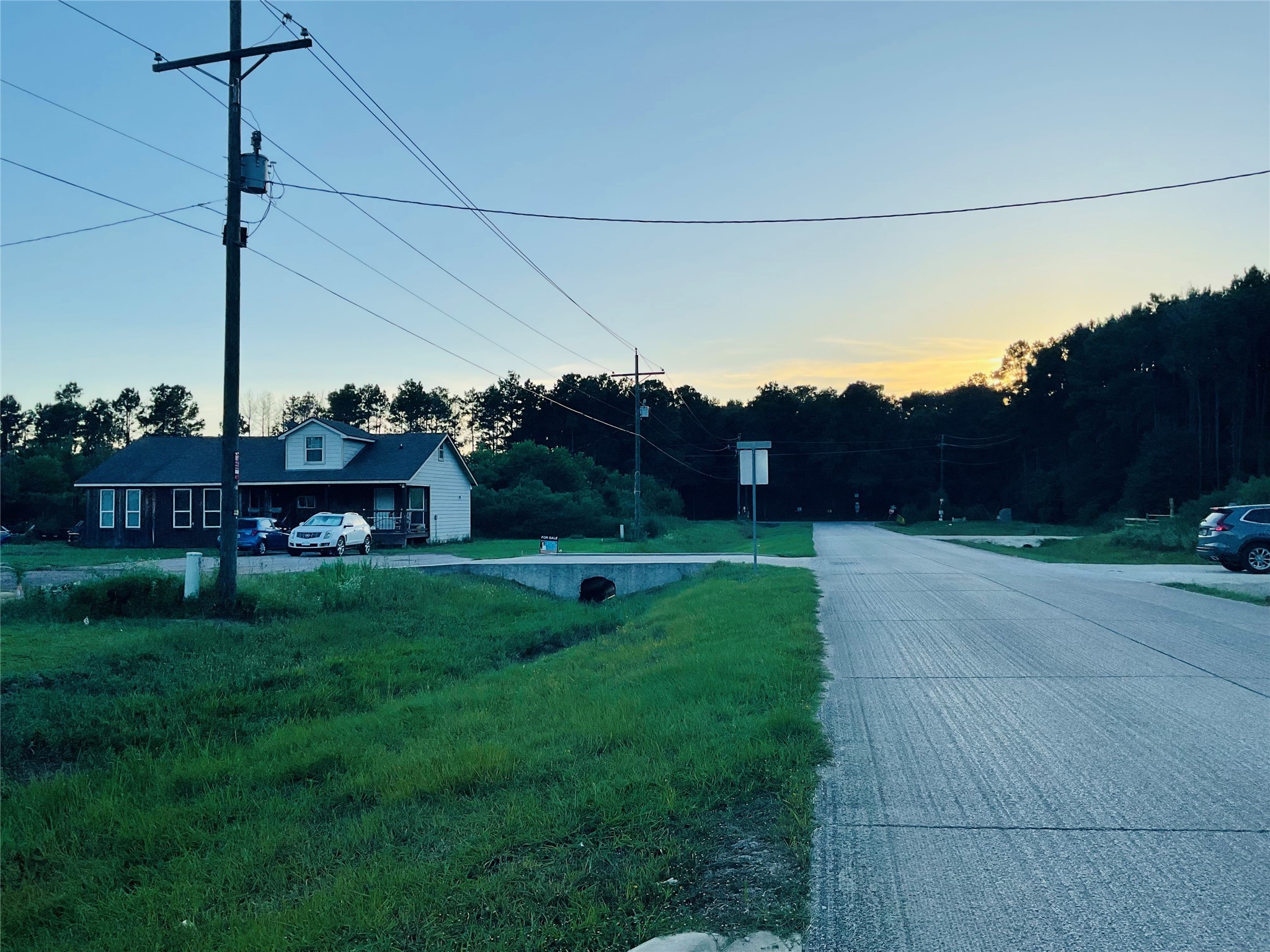 76 County Road 3540 Cleveland, TX 77327 - Photo 16 of 26 a view of a house with a park
