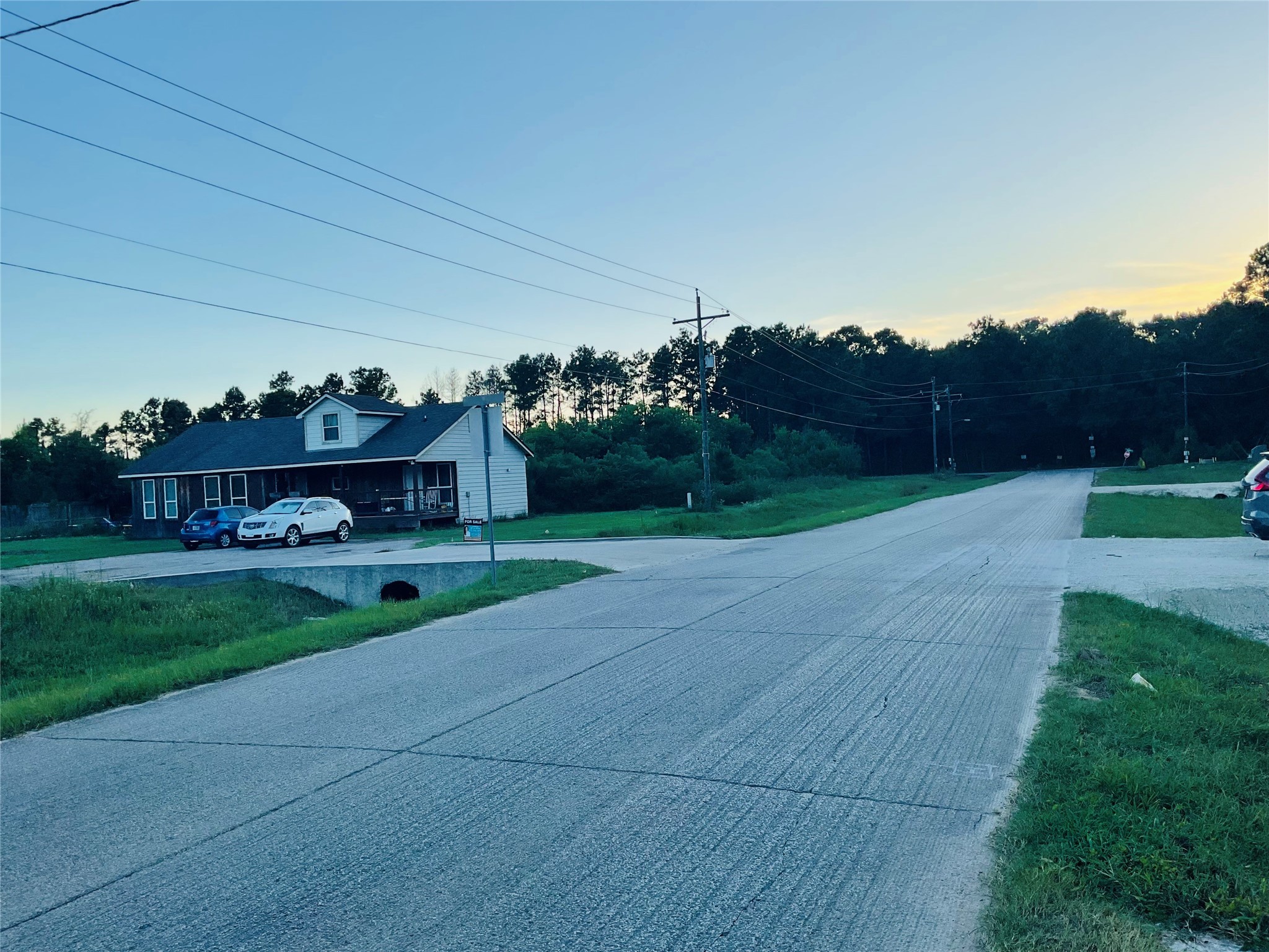 76 County Road 3540 Cleveland, TX 77327 - Photo 17 of 26 a view of a house with backyard and garden