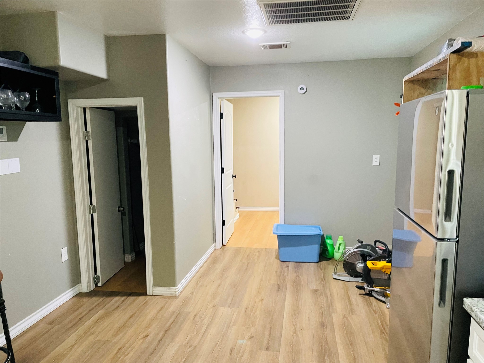 76 County Road 3540 Cleveland, TX 77327 - Photo 20 of 26 a room with a couch and a wooden floor