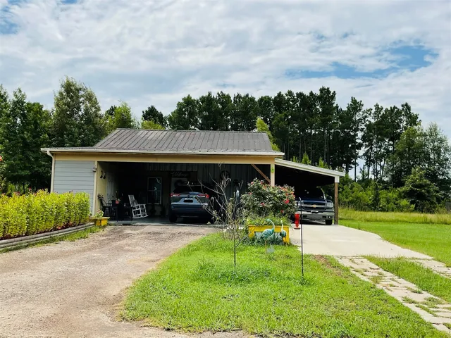 a view of a chair and table in the garden and yard