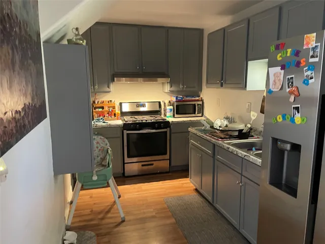 a bedroom with furniture and a baby crib