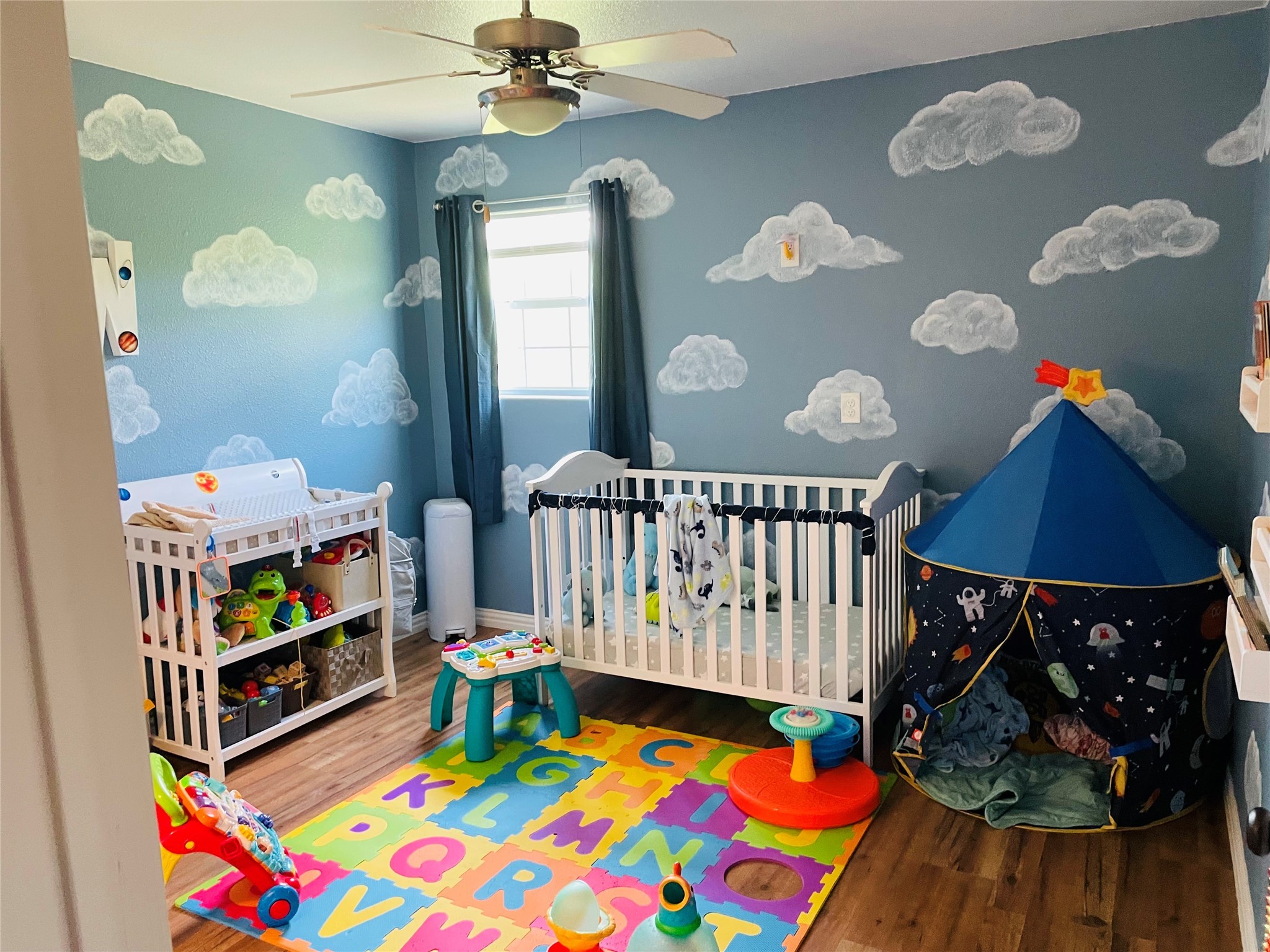 76 County Road 3540 Cleveland, TX 77327 - Photo 24 of 26 a bedroom with furniture and a baby crib