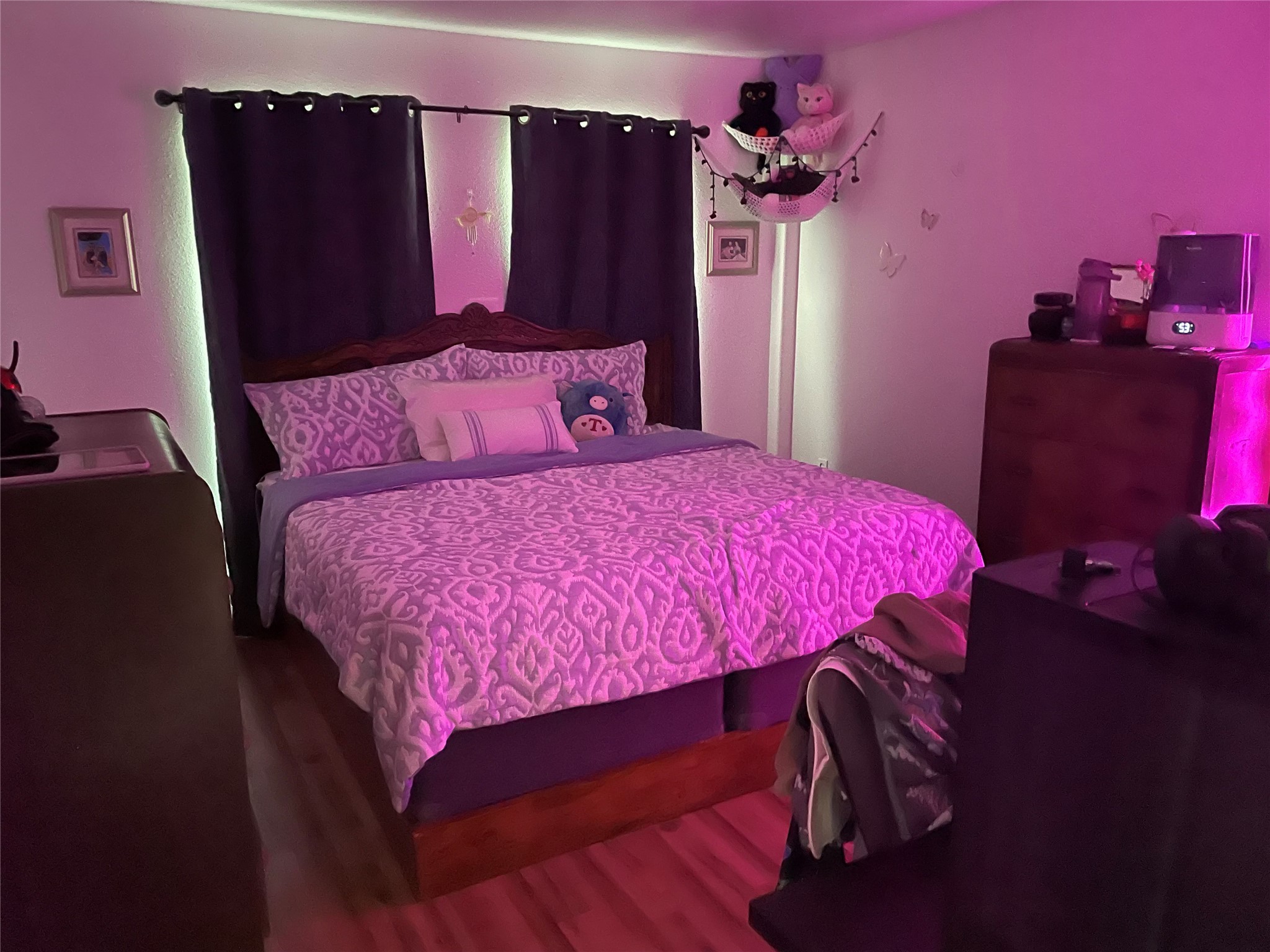 76 County Road 3540 Cleveland, TX 77327 - Photo 25 of 26 a bedroom with a bed a dresser and a mirror