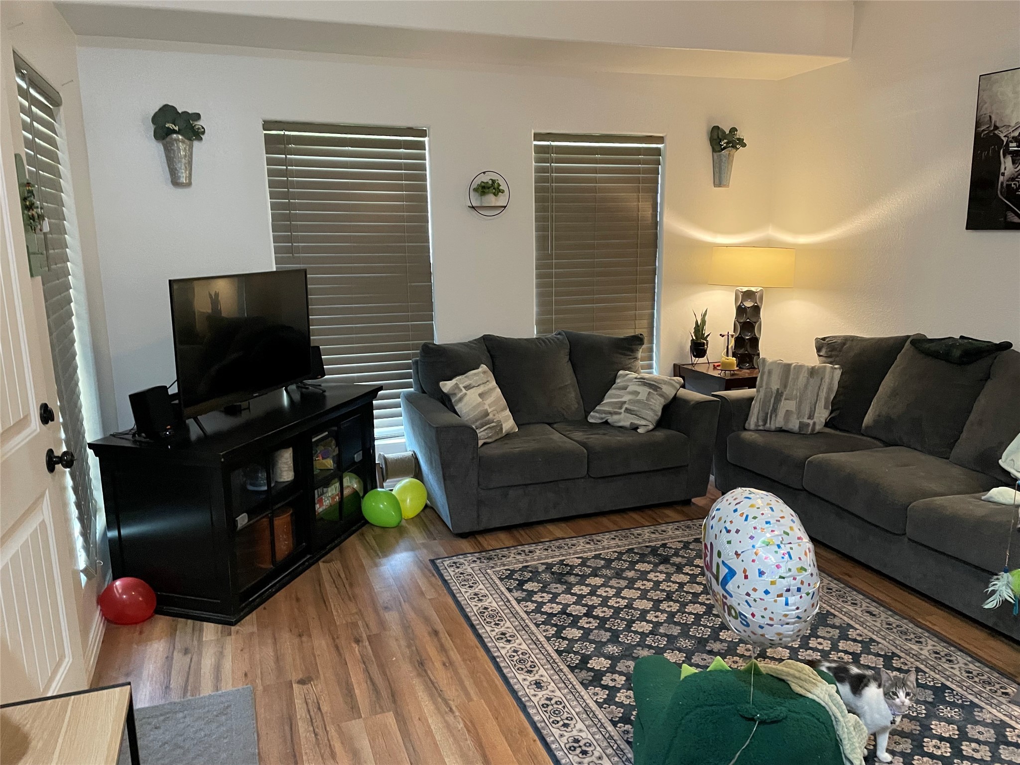 76 County Road 3540 Cleveland, TX 77327 - Photo 26 of 26 a living room with furniture and a flat screen tv