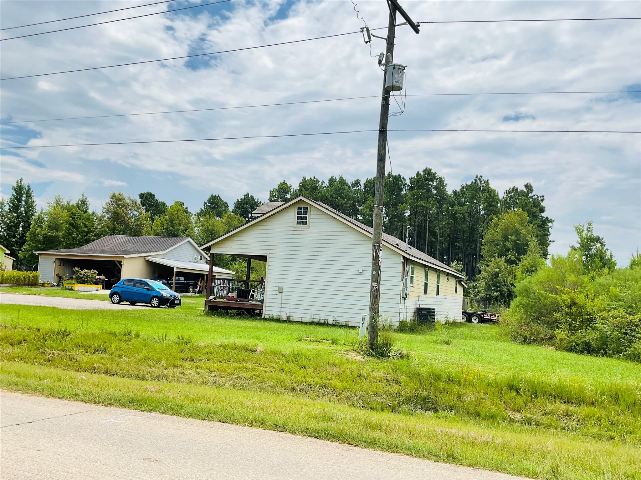 76 County Road 3540 Cleveland, TX 77327 - Photo 4 of 26 a front view of house with yard and green space