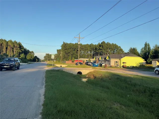 a view of street with parked cars