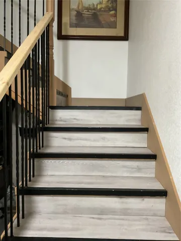 a bedroom with two bed and a dresser