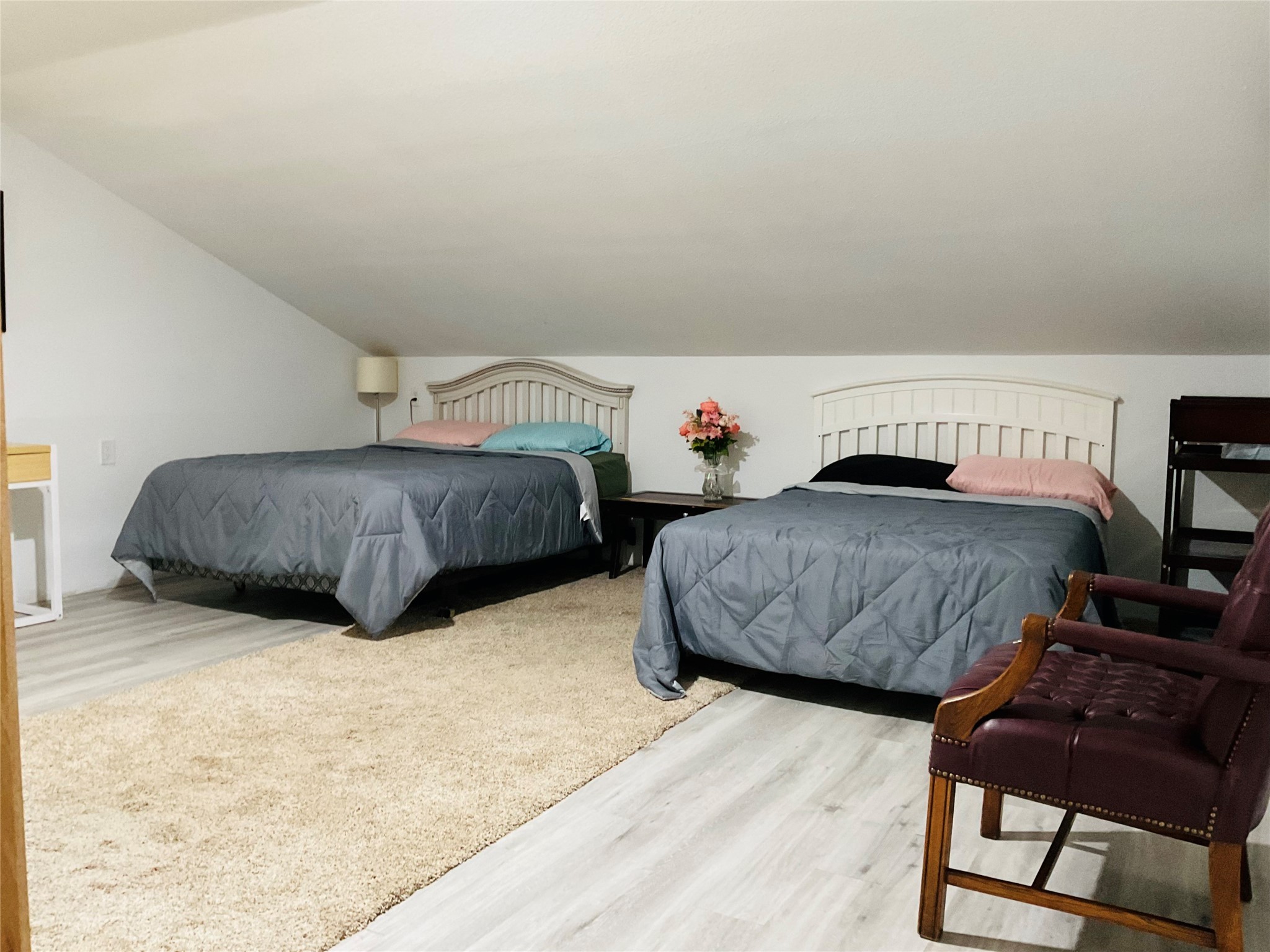 76 County Road 3540 Cleveland, TX 77327 - Photo 7 of 26 a bedroom with two bed and a dresser