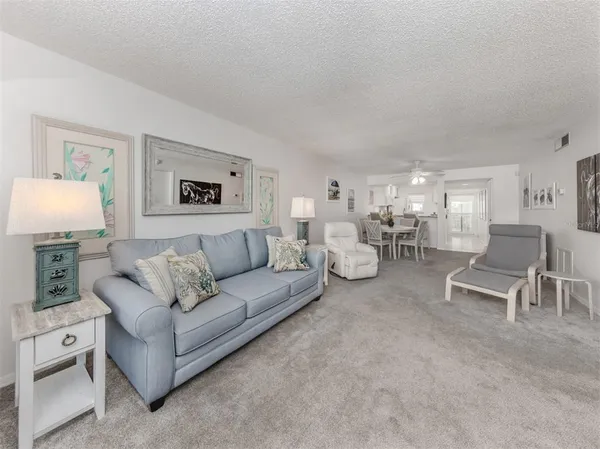 a living room with furniture and a lamp
