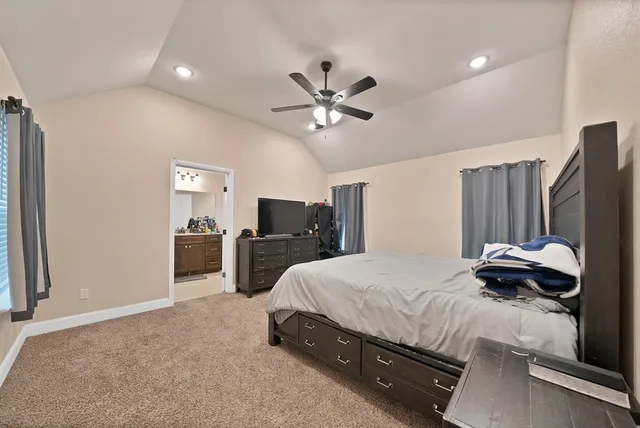 a bedroom with bed and tv