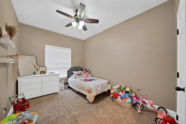 a bedroom with furniture and a bed