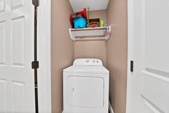 a view of a workspace with furniture and a flat screen tv