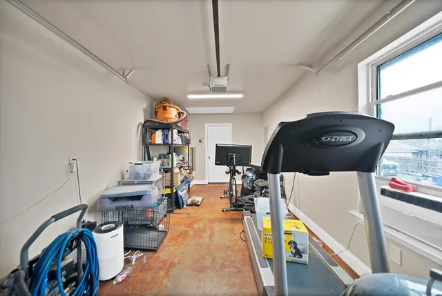 a view of a backyard with table and chairs