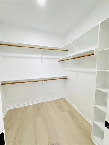 a view of an empty walk in closet