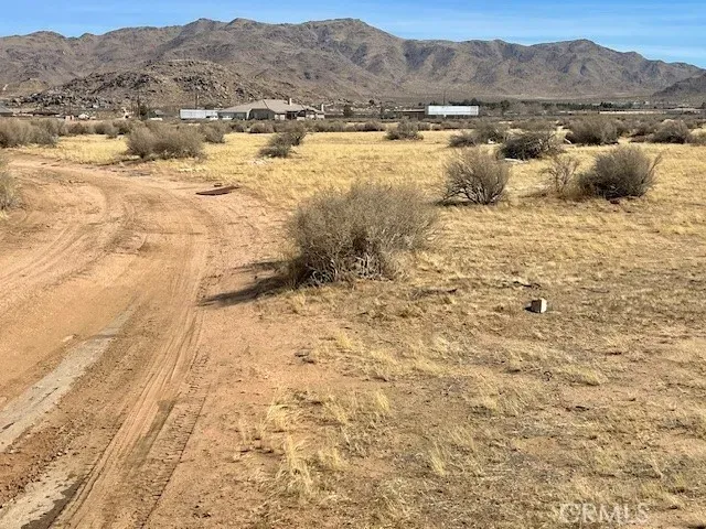 a view of a lake with mountains in the background