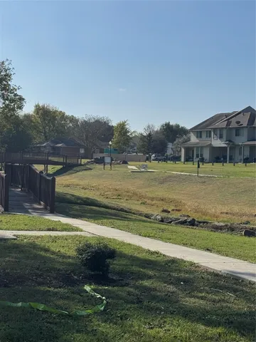 a view of a lake with houses in the background