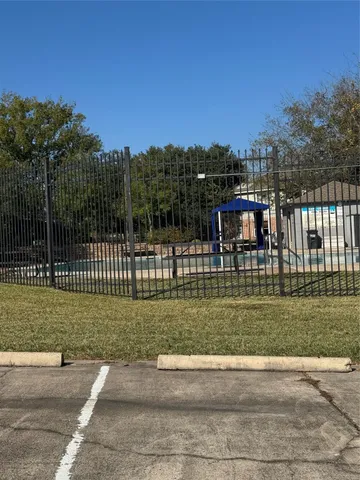 a view of a park with a large trees