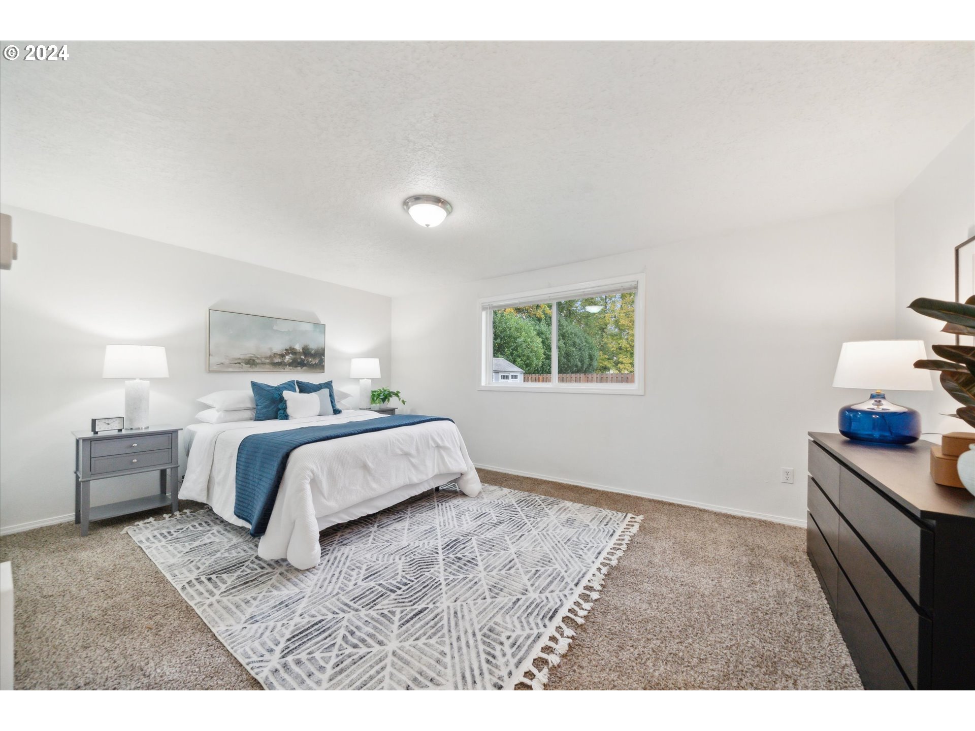 2144 Northeast 38th Drive Gresham, OR 97030 - Photo 11 of 23 a bedroom with a bed and a window