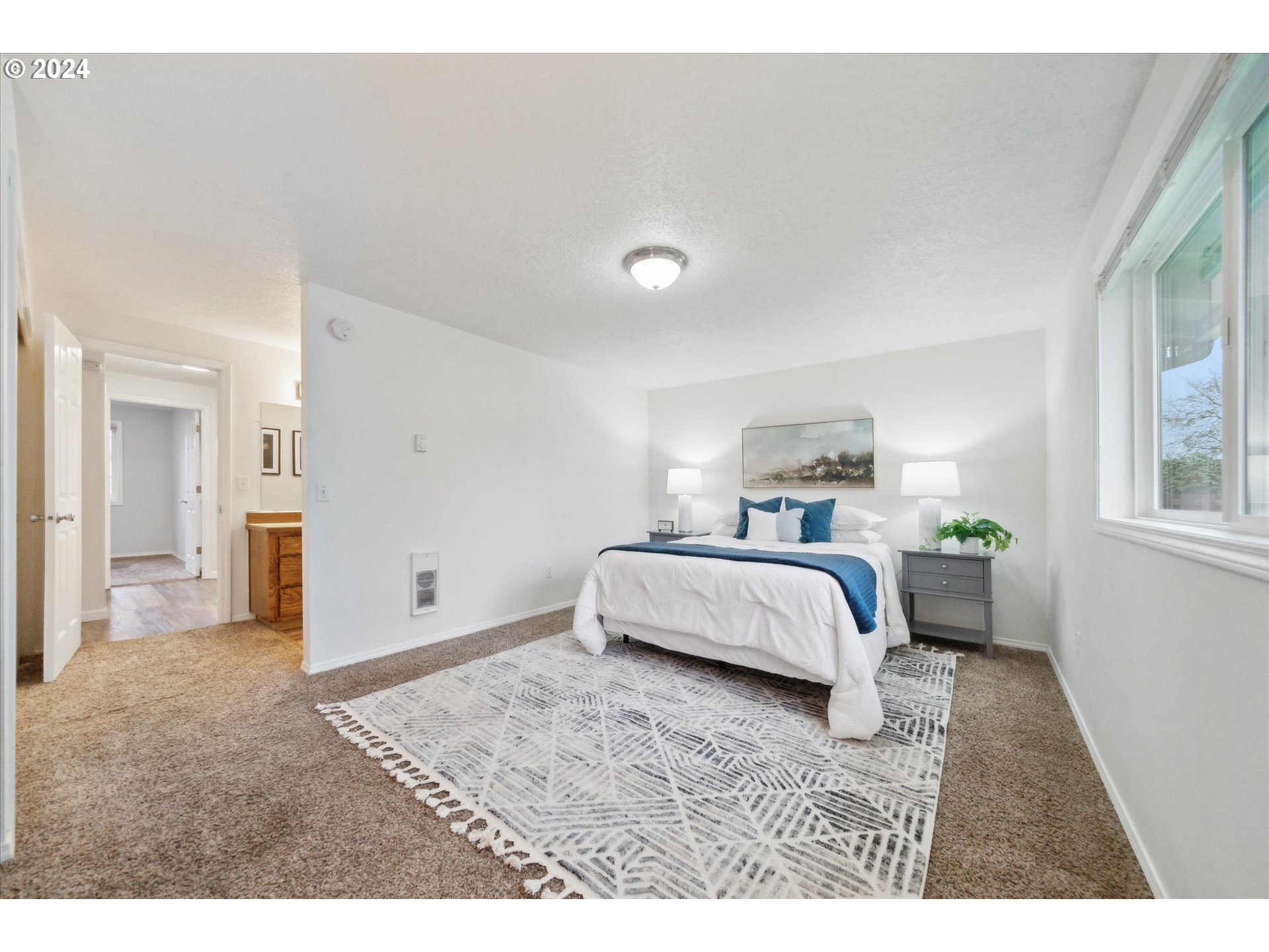 2144 Northeast 38th Drive Gresham, OR 97030 - Photo 12 of 23 a bedroom with a bed and window