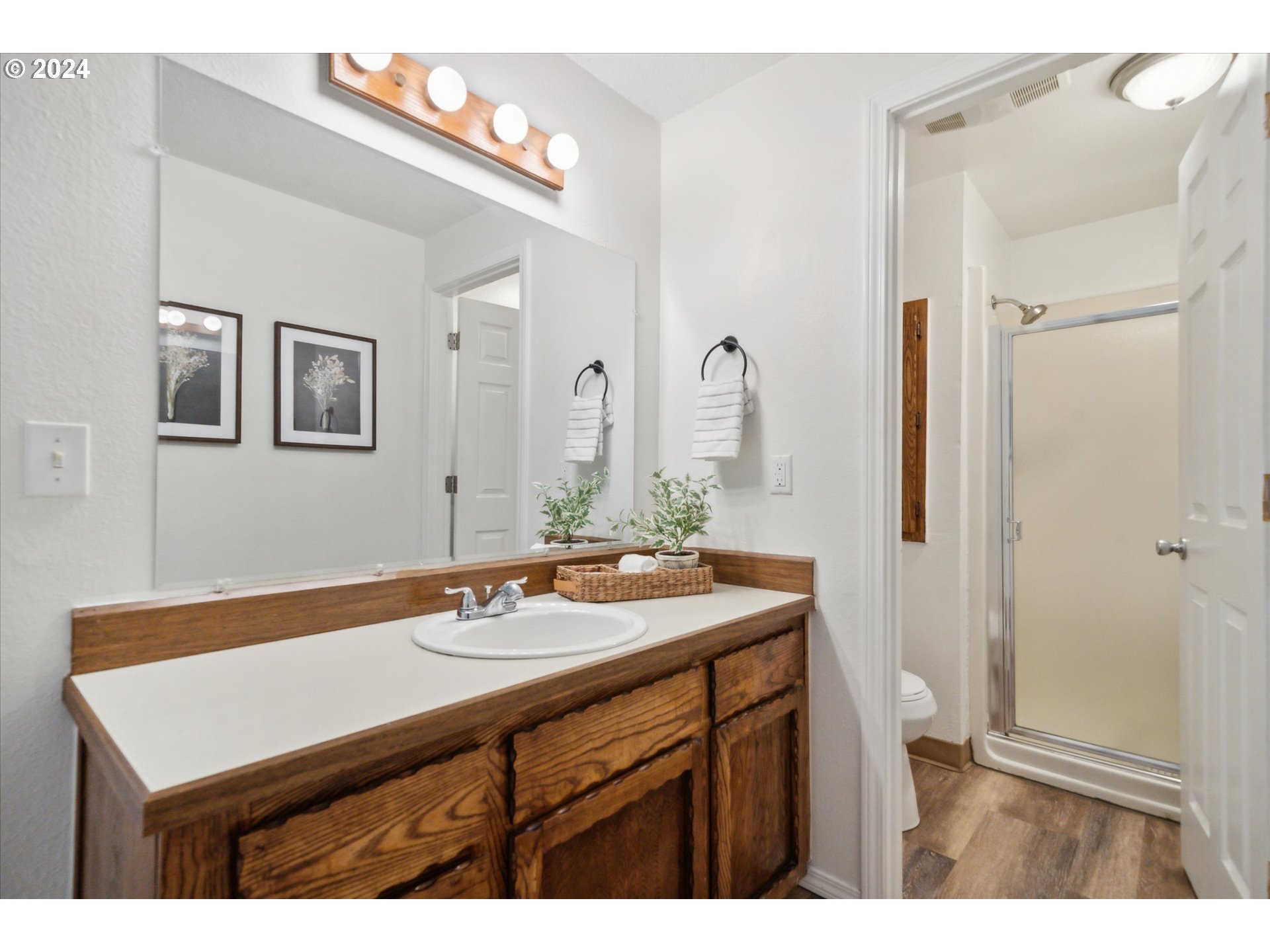 2144 Northeast 38th Drive Gresham, OR 97030 - Photo 13 of 23 a bathroom with a sink vanity granite and a mirror