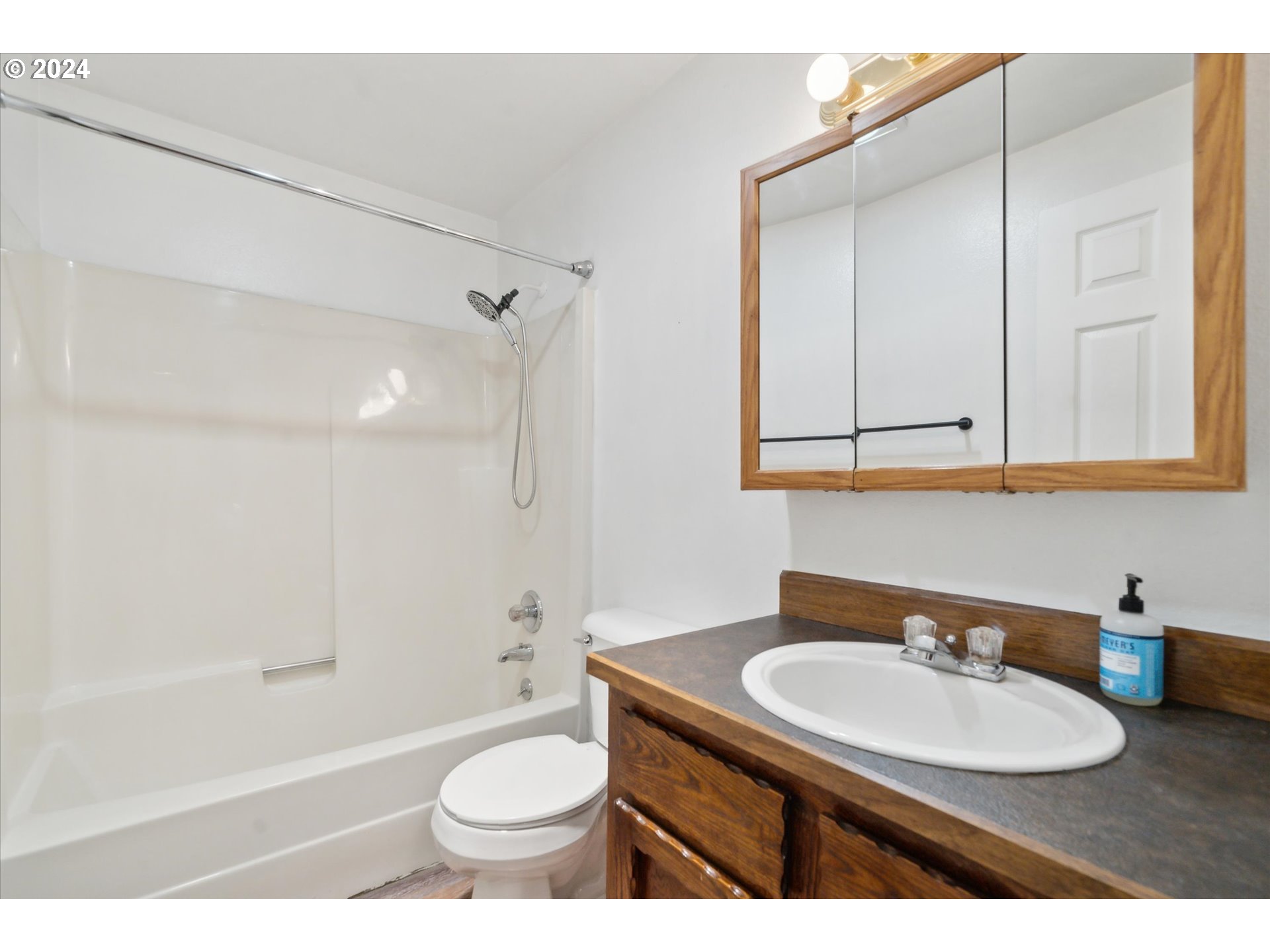 2144 Northeast 38th Drive Gresham, OR 97030 - Photo 18 of 23 a bathroom with a sink a toilet and shower