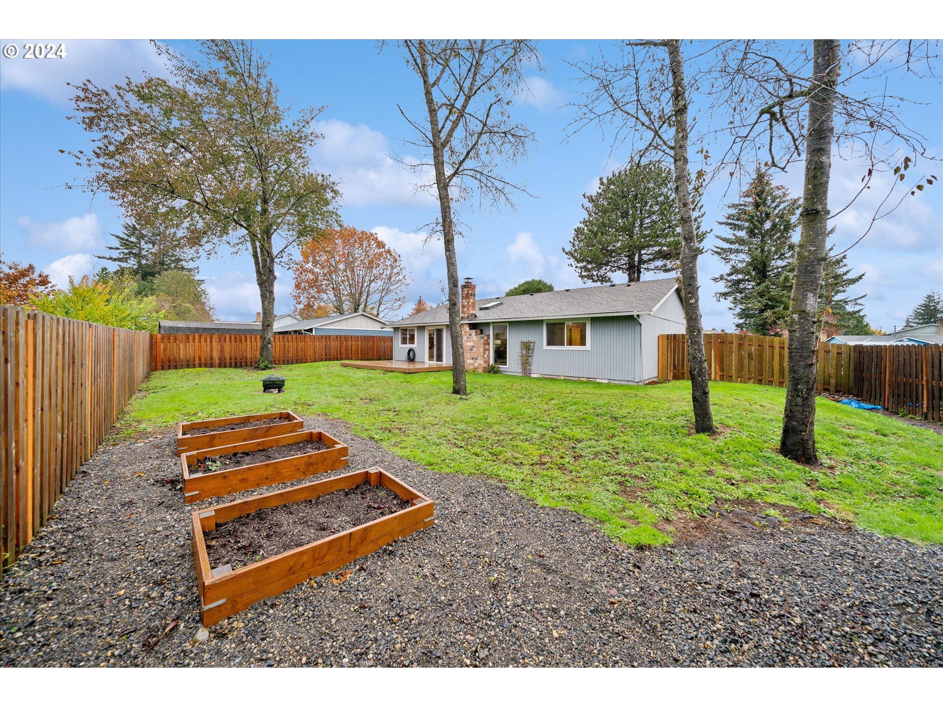 2144 Northeast 38th Drive Gresham, OR 97030 - Photo 21 of 23 a backyard of a house with table and chairs