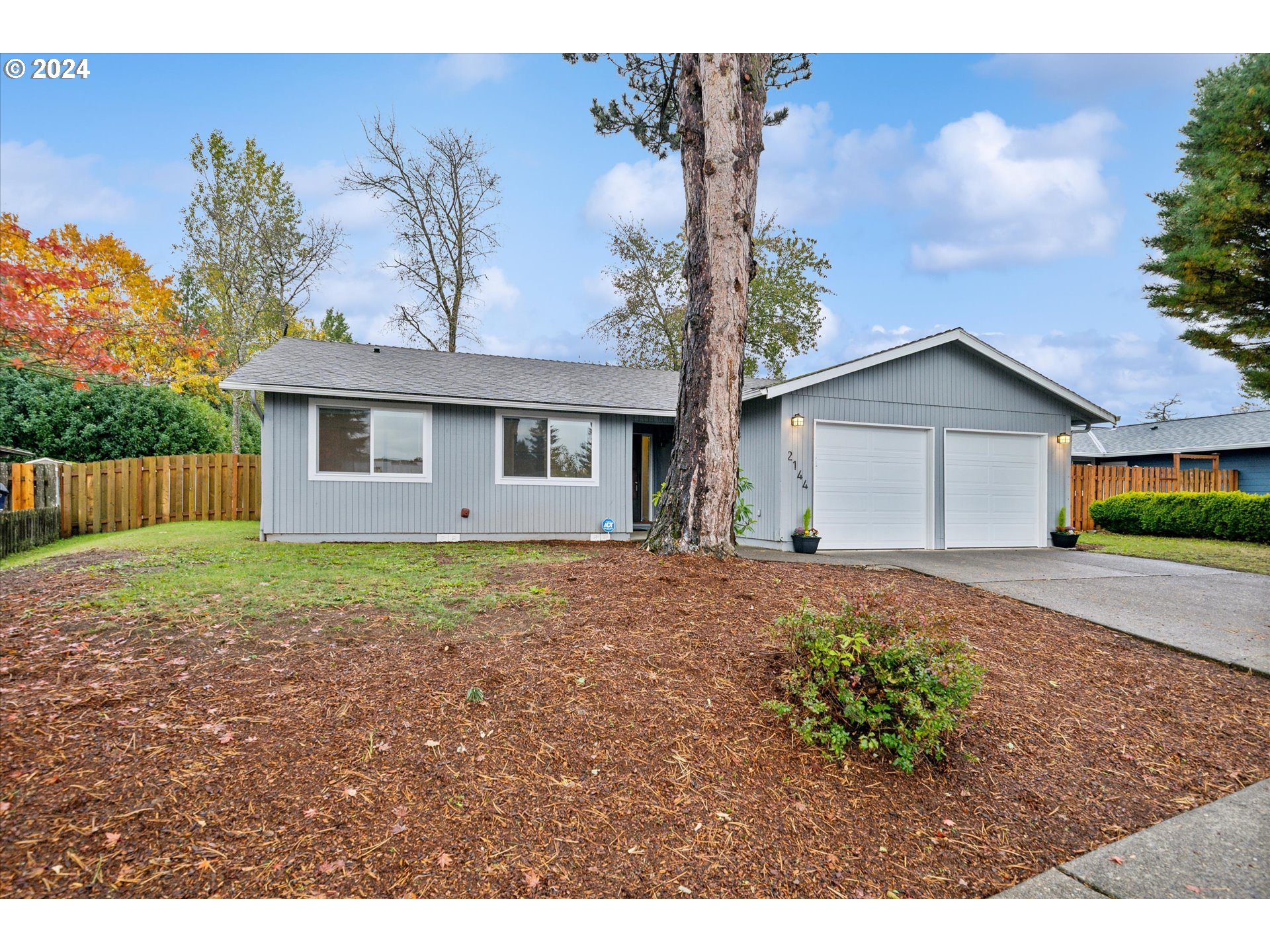 2144 Northeast 38th Drive Gresham, OR 97030 - Photo 23 of 23 a view of a house with a yard and a garden
