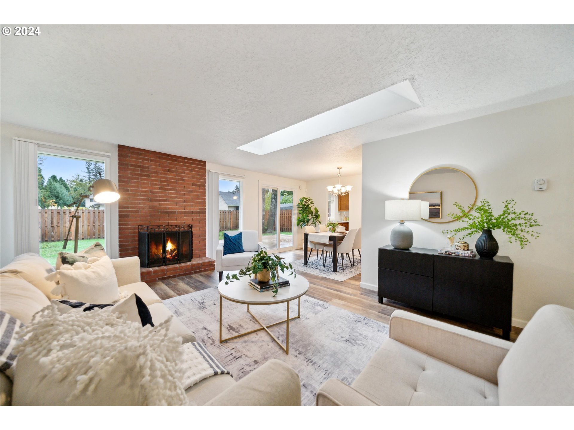 2144 Northeast 38th Drive Gresham, OR 97030 - Photo 3 of 23 a living room with furniture a fireplace and a potted plant