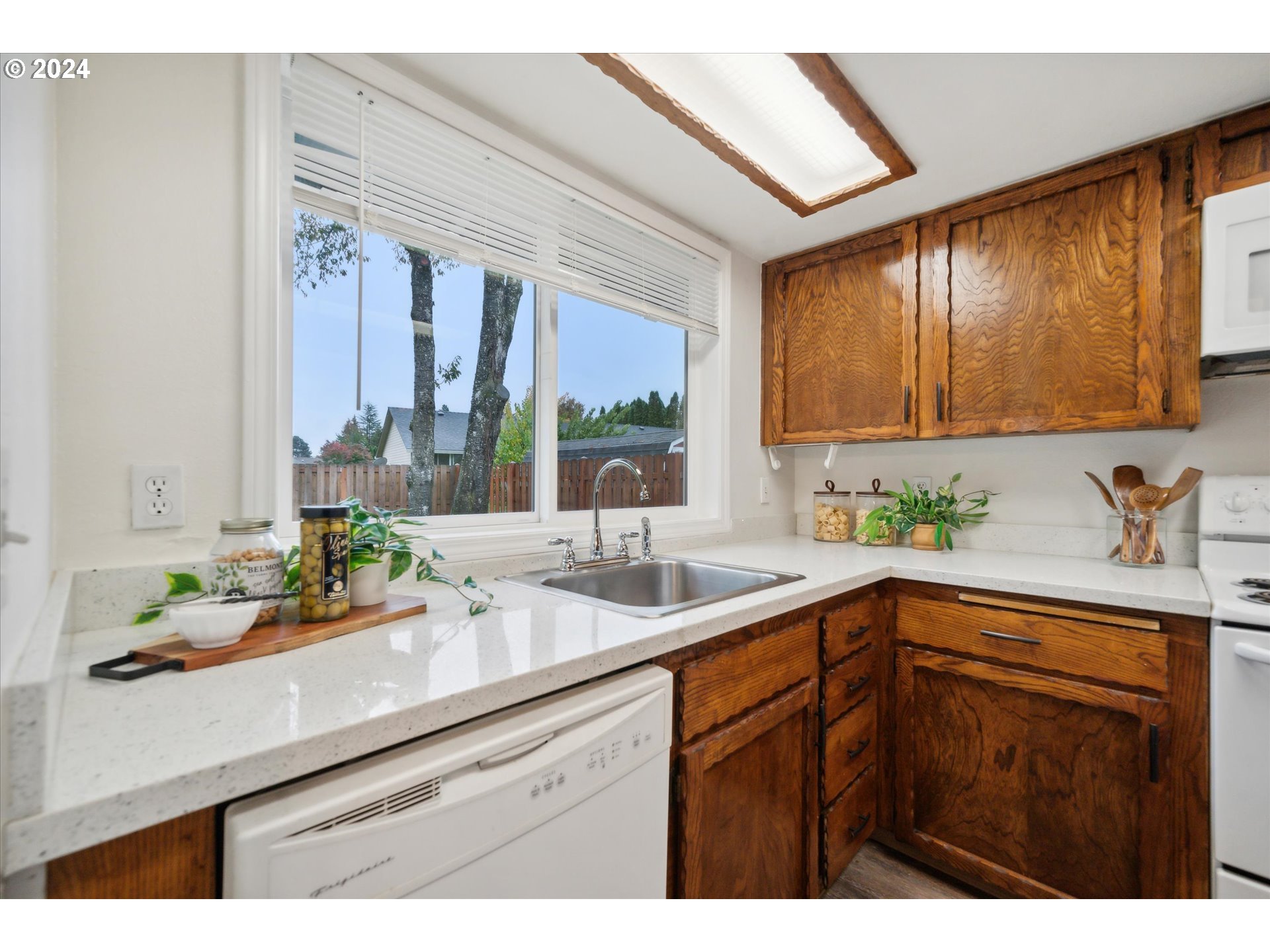 2144 Northeast 38th Drive Gresham, OR 97030 - Photo 6 of 23 a kitchen with a sink and a window