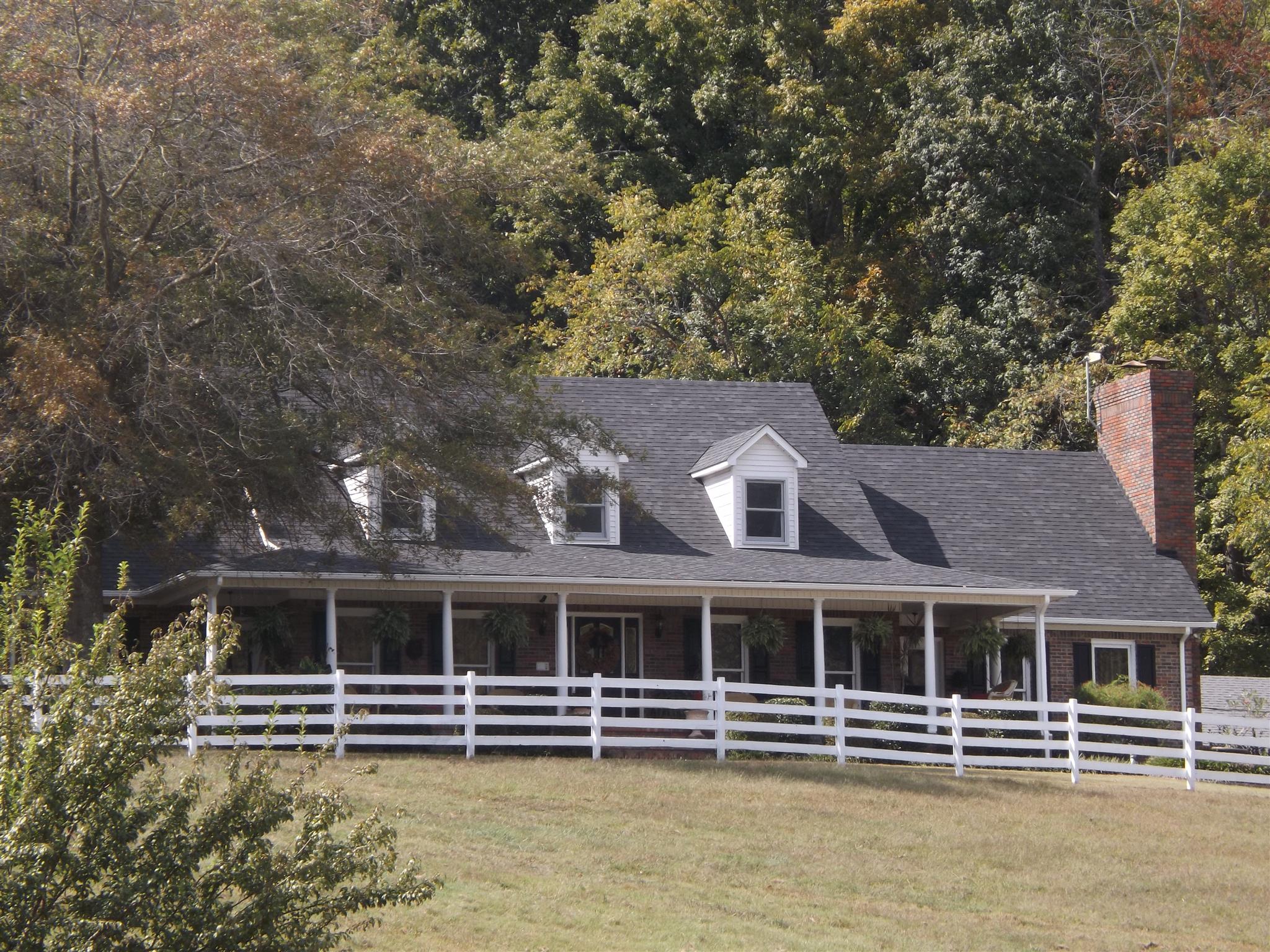 197 Story Road Goodspring, TN 38460 - Photo 1 of 29 a front view of a house with a large tree