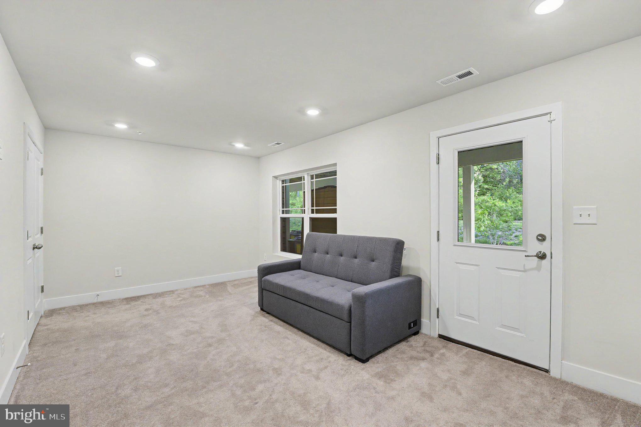 238 Waterstone Road Essex, MD 21221 - Photo 7 of 39 a living room with furniture and a window