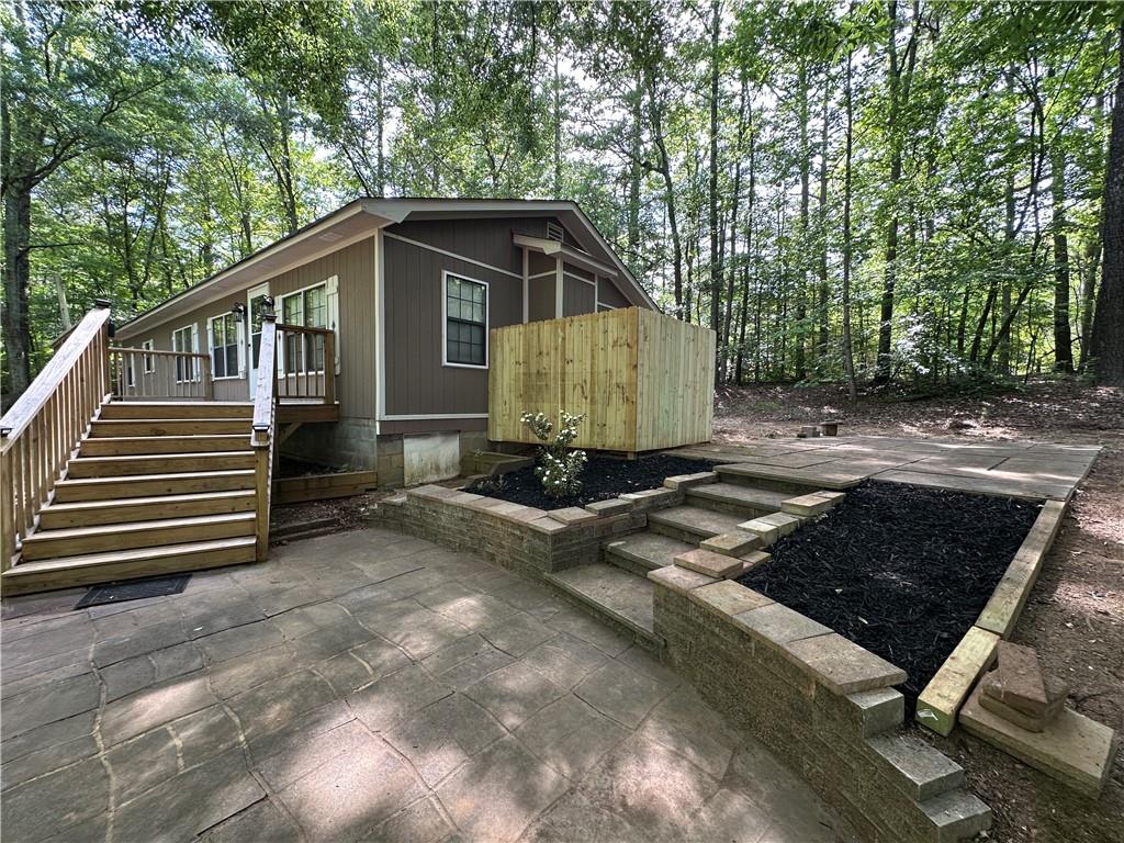 710 Spiva Road Temple, GA 30179 - Photo 4 of 31 a backyard of a house with barbeque oven