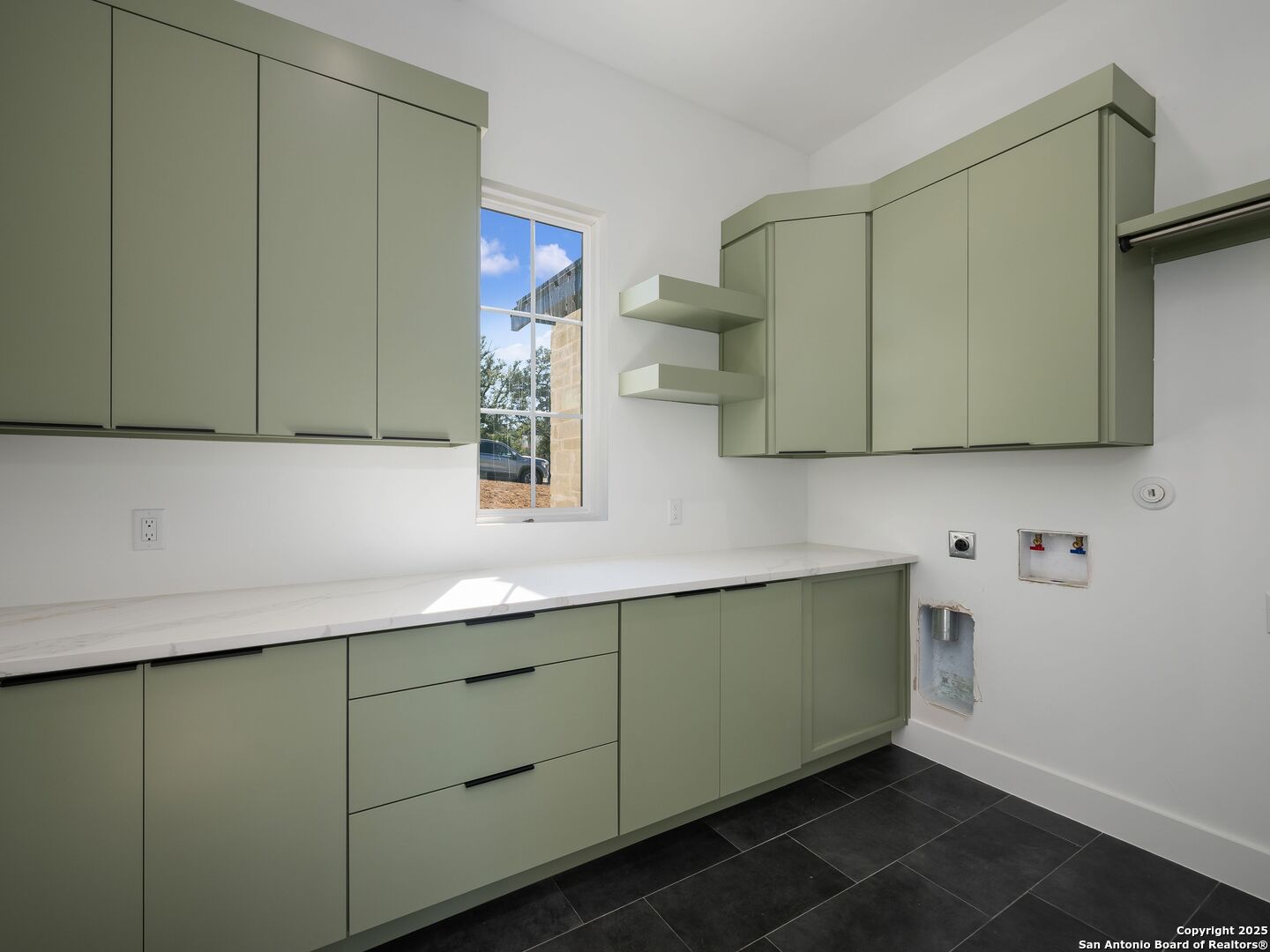 10907 Nina Ridge San Antonio, TX 78255 - Photo 15 of 54 a kitchen with a sink and cabinets
