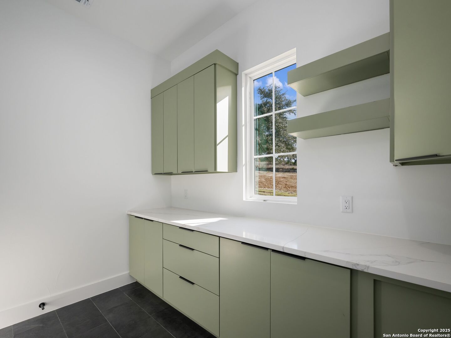 10907 Nina Ridge San Antonio, TX 78255 - Photo 16 of 54 a bathroom with a sink and a mirror