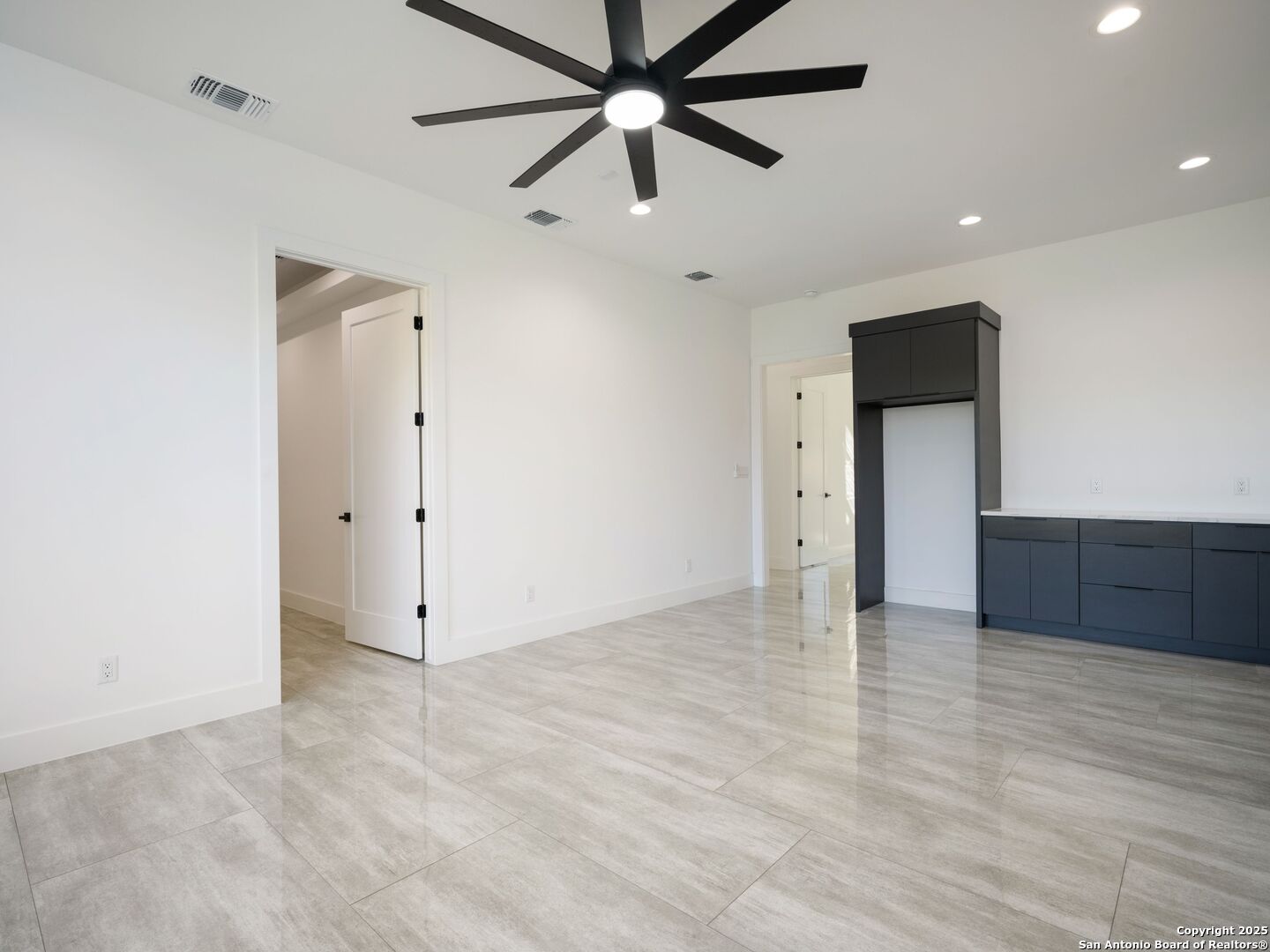 10907 Nina Ridge San Antonio, TX 78255 - Photo 28 of 54 an empty room with fan and a ceiling fan