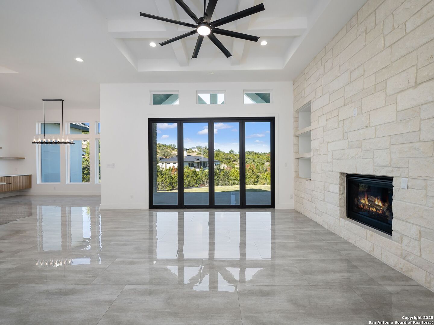 10907 Nina Ridge San Antonio, TX 78255 - Photo 3 of 54 a view of a livingroom with a fireplace and window