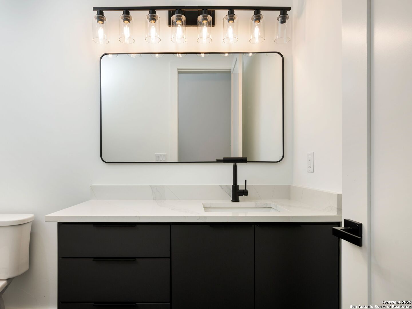 10907 Nina Ridge San Antonio, TX 78255 - Photo 39 of 54 a close view of light fixtures and a sink