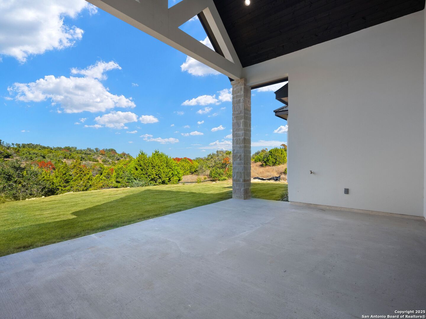 10907 Nina Ridge San Antonio, TX 78255 - Photo 40 of 54 a view of an empty room with a yard
