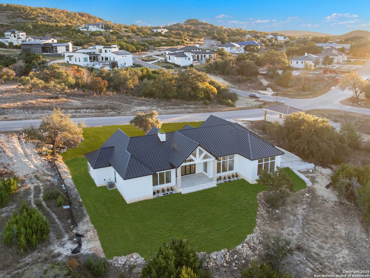 10907 Nina Ridge San Antonio, TX 78255 - Photo 48 of 54 an aerial view of residential houses with outdoor space