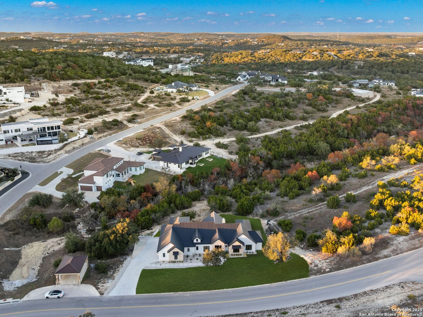10907 Nina Ridge San Antonio, TX 78255 - Photo 52 of 54 an aerial view of residential houses with outdoor space