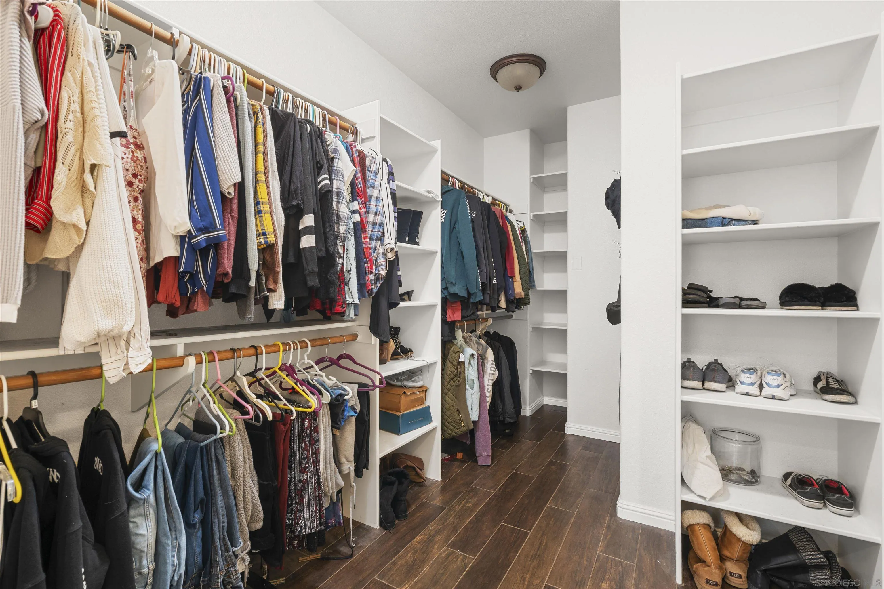 24534 Rutherford Road Ramona, CA 92065 - Photo 14 of 19 a view of walk in closet with clothes and shoes