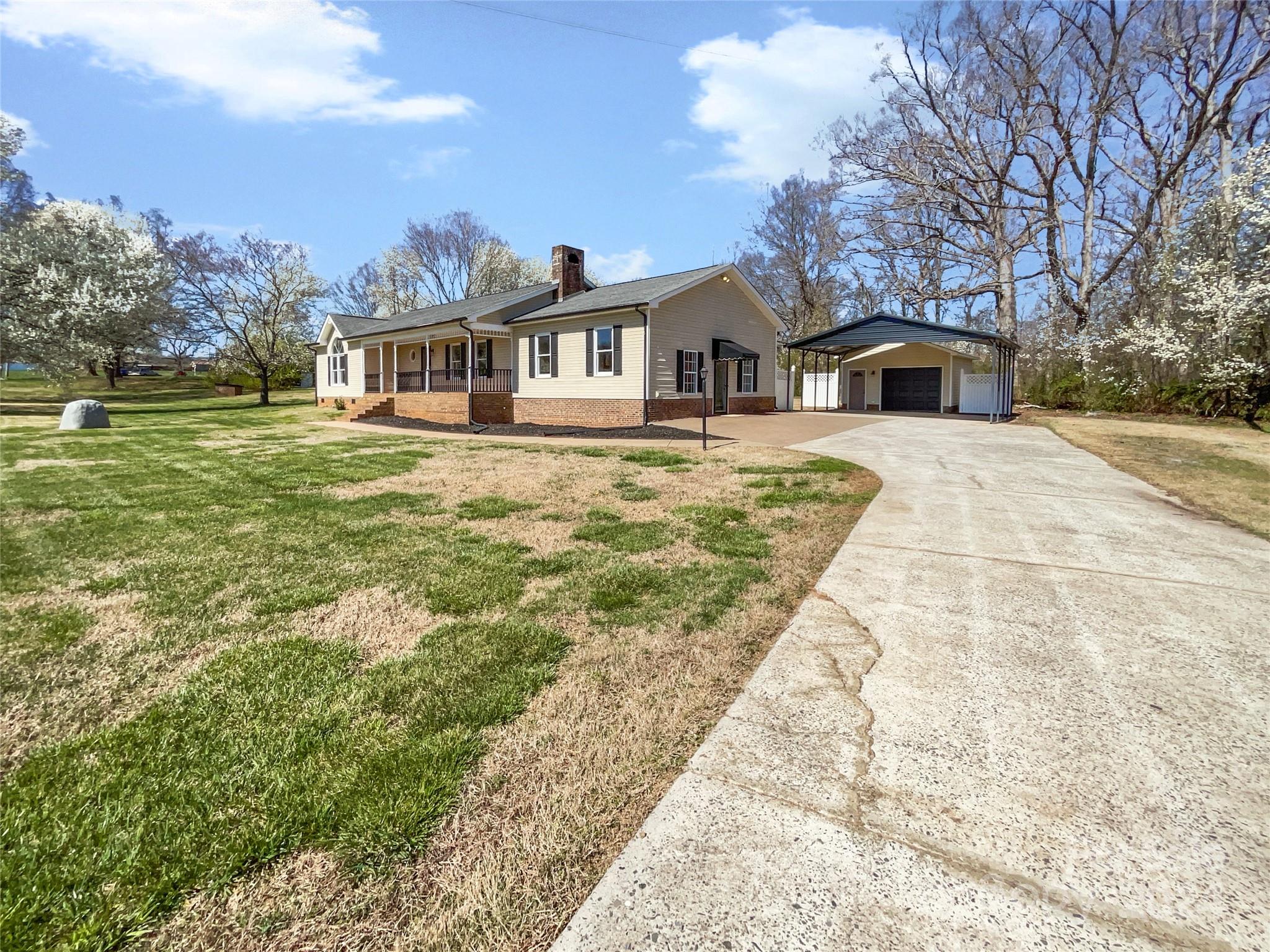 1412 Tot Dellinger Road Cherryville, NC 28021 - Photo 6 of 19 a front view of a house with garden