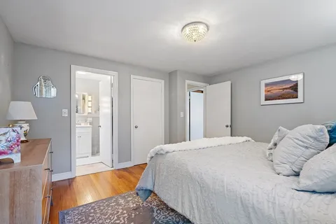 a bedroom with a bed and a couch