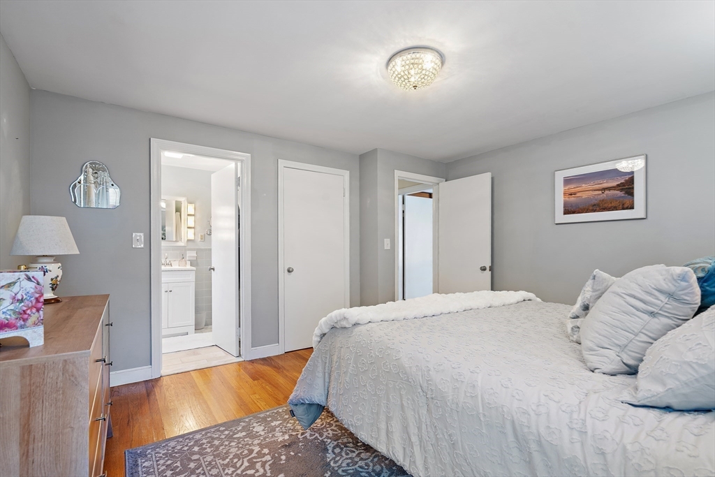 16 Beaudry Street Marlborough, MA 01752 - Photo 14 of 40 a bedroom with a bed and a couch